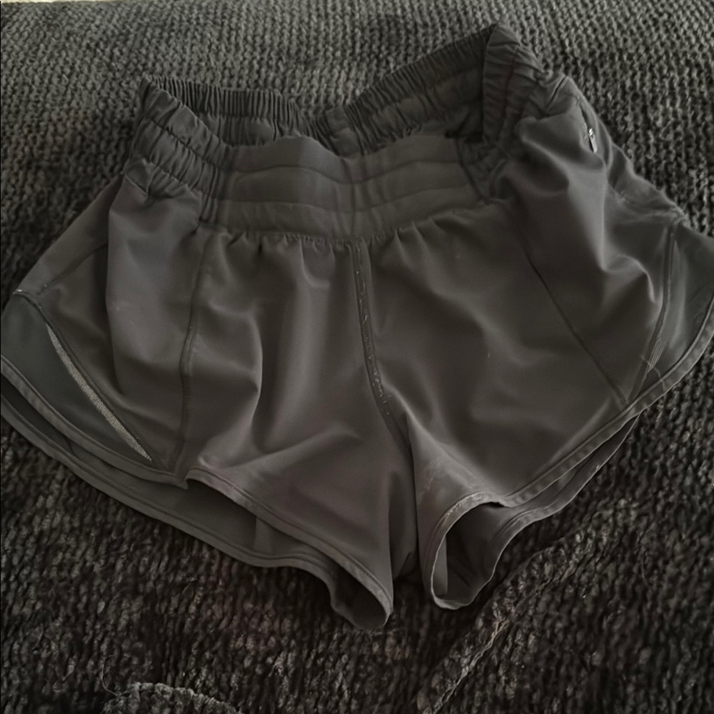 Black Lululemon hotty hot size 2, 2.5” inseam. Liner cut out